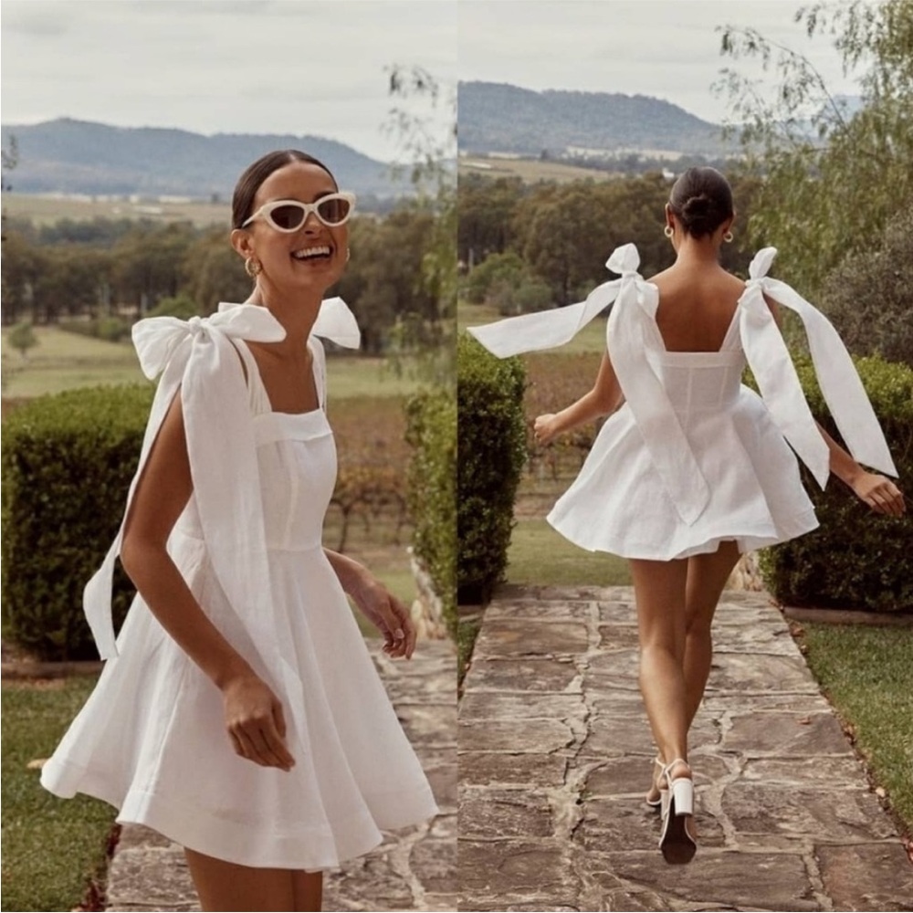 Dissh White Mini Dress with Sleek Silhouette. 100% linen.Worn once. Like new